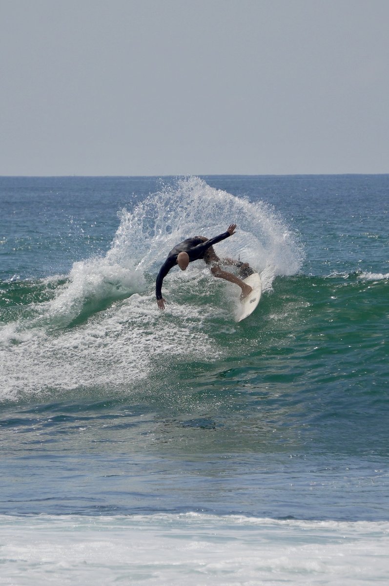 Surfer paddling out at Dreamer's Surfhouse