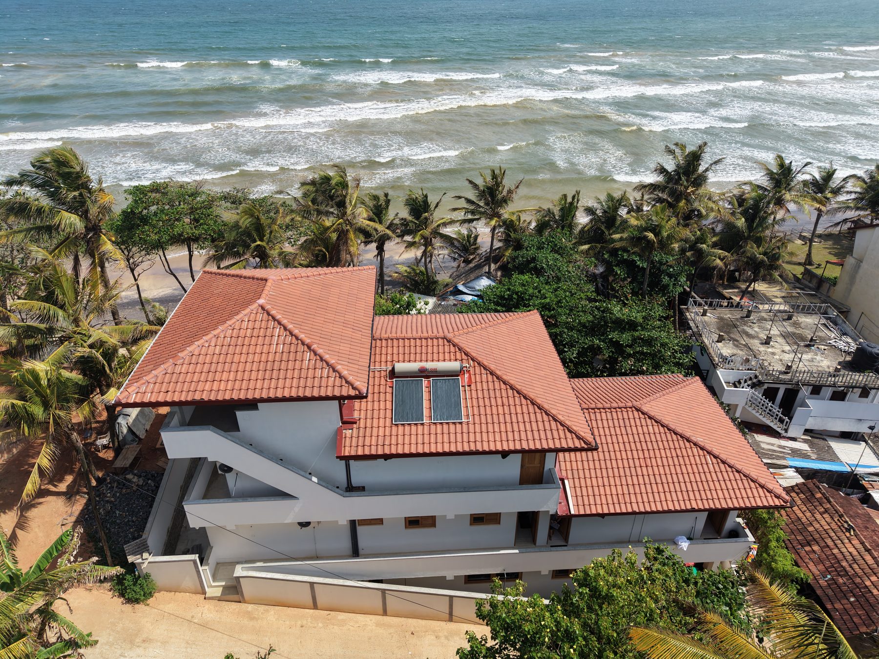 Aerial view over Dreamer's Surfhouse and the ocean